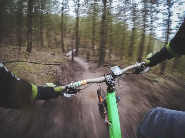 Person mountain biking an activity which can be tracked with an Apple Watch