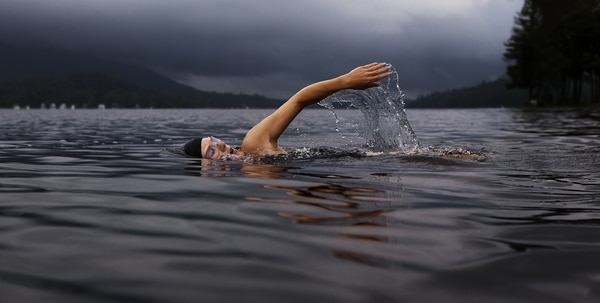 Person swimming in open water